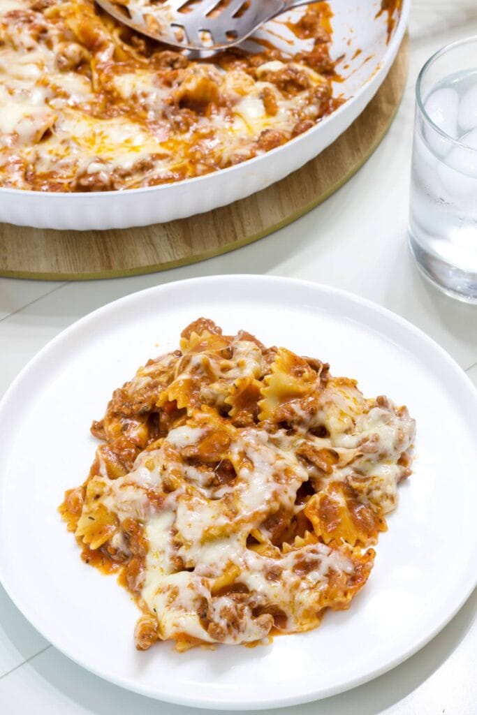 Overhead shot of a serving of Homemade Hamburger Helper Lasagna on a white plate.