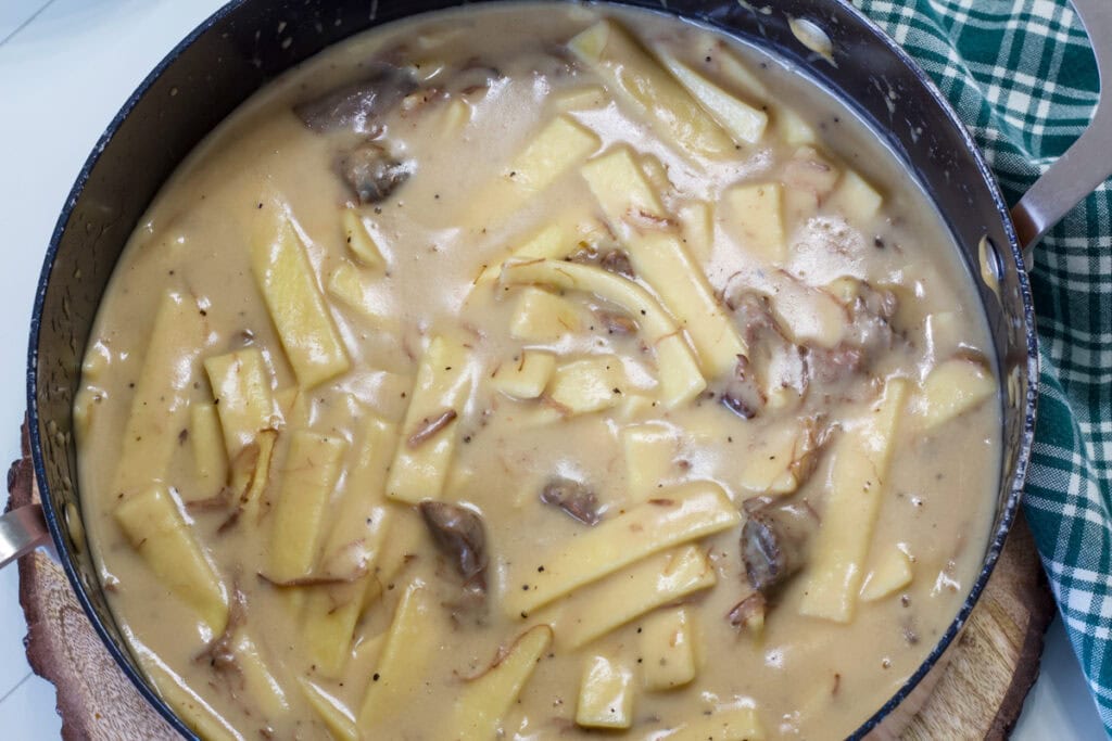 Overhead close up of a Dutch oven full of Leftover Roast Beef and Noodles.