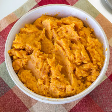 Close up overhead view of the entire batch of Mashed Sweet Potatoes in a bowl ready to be served.