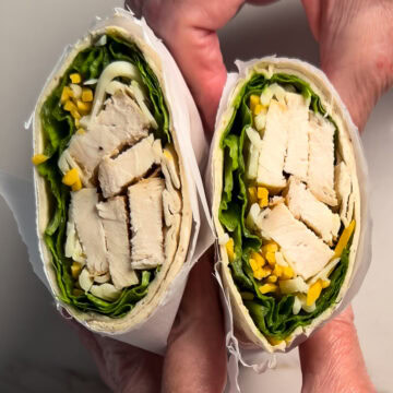 Two halves of the Grilled Chicken Cool Wrap (copycat Chick-fil-A) so the inside is visible.