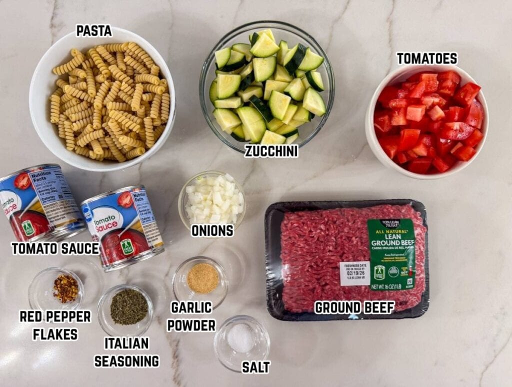 All of the ingredients needed to make the Pasta with Zucchini and Tomatoes recipe.