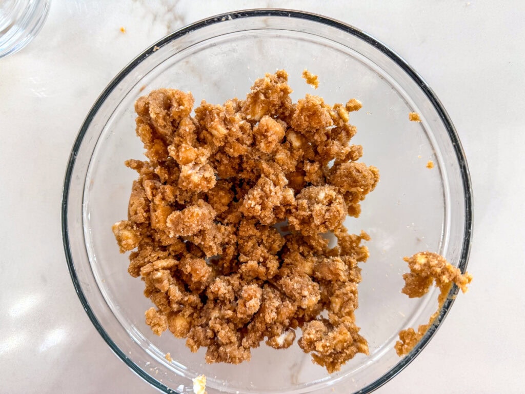 The topping ingredients mixed together in a medium glass bowl.