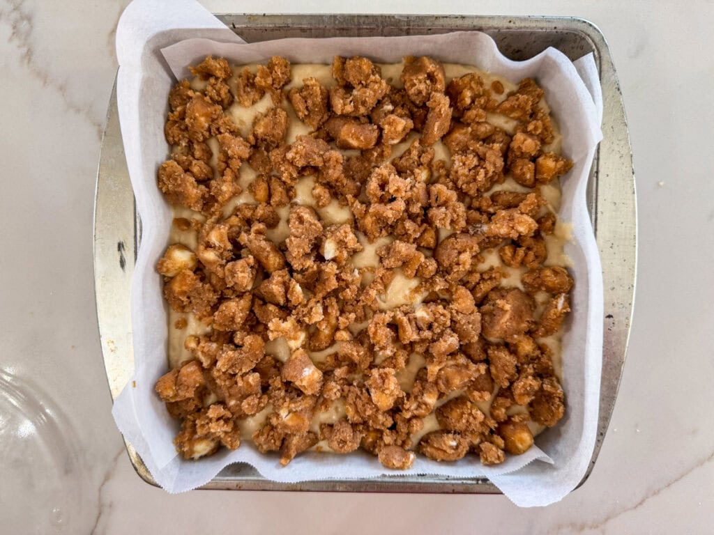 The batter in the pan, topped with the brown sugar topping ready to go into the oven.