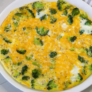 Close up of just the frittata on a plate ready to be served.