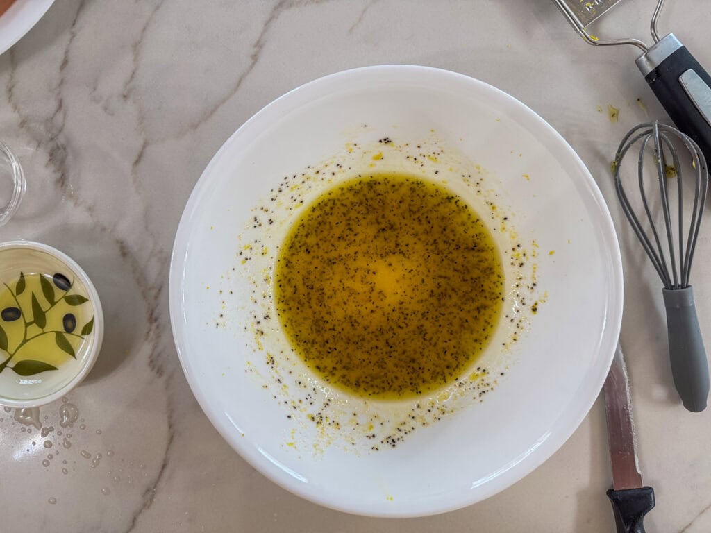 The olive oil and spices mixed together in a bowl.