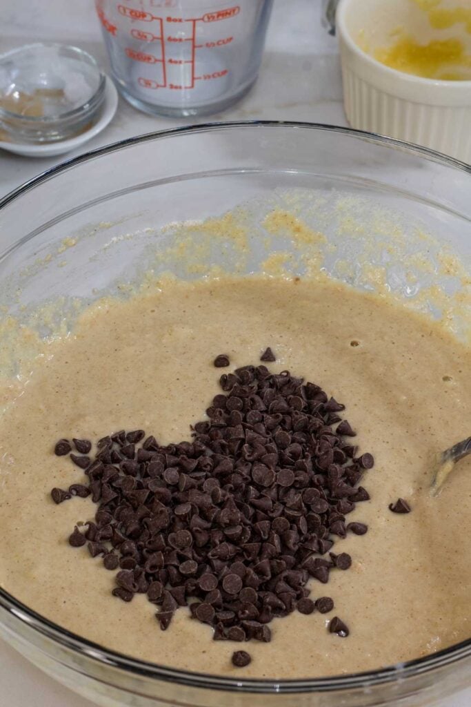 The mini chocolate chips added to the muffin batter before being mixed in.