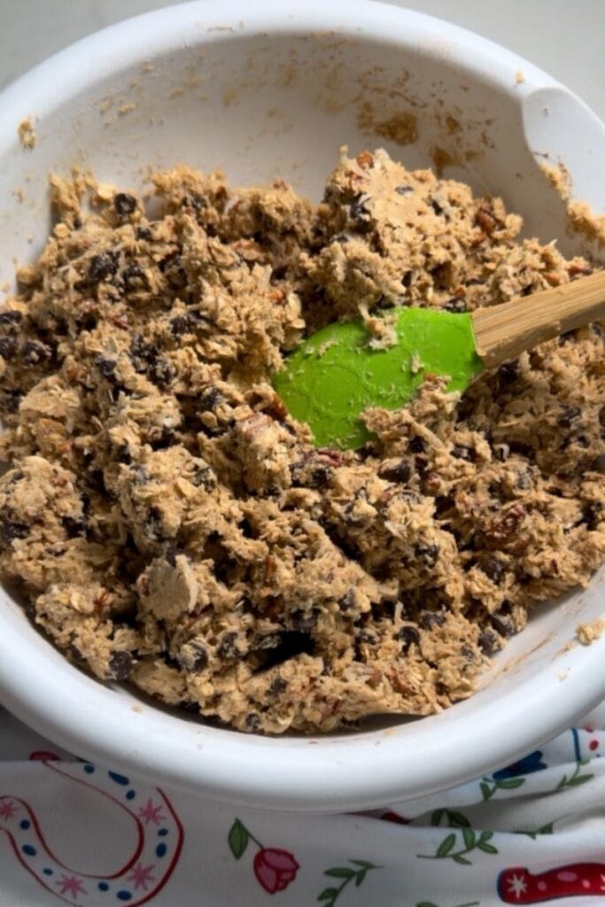 The oats, coconut, chocolate chips and pecans added to the cookie dough.