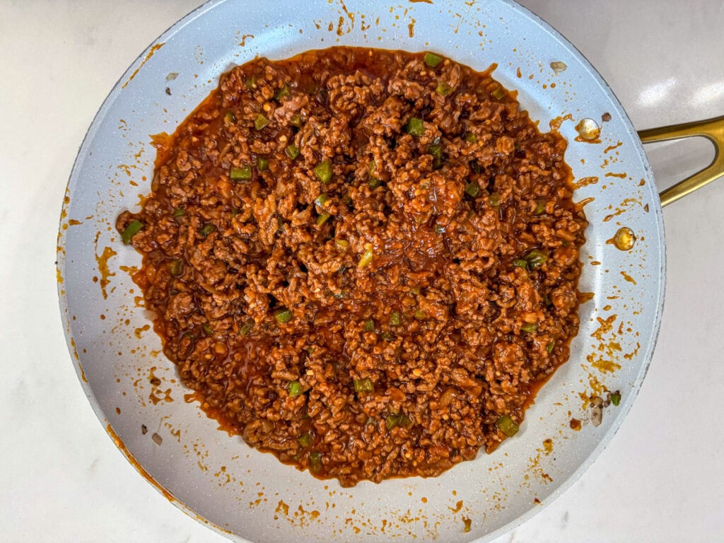 The cooked sloppy joe mixture in a skillet.