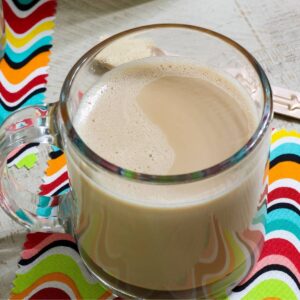 Overhead close up of one cup of homemade vanilla coffee.
