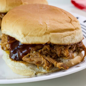 Side close up of a slow cooker pulled pork tenderloin sandwich.