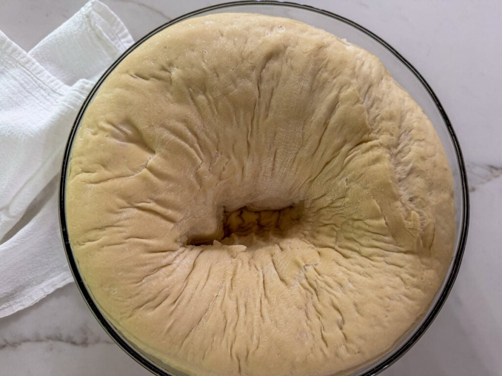The dough after the first rise and it's been punched down.