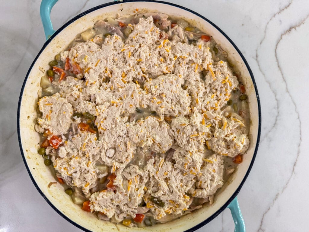 The biscuit mix spread out a bit on top of the filling in a skillet.
