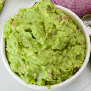 Overhead closeup of a bowl of homemade guacamole.