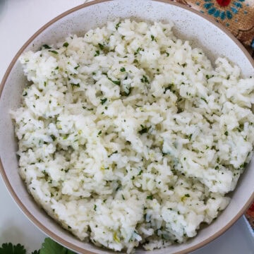 Overhead closeup of a serving bowl full of copycat chipotle cilantro lime rice.