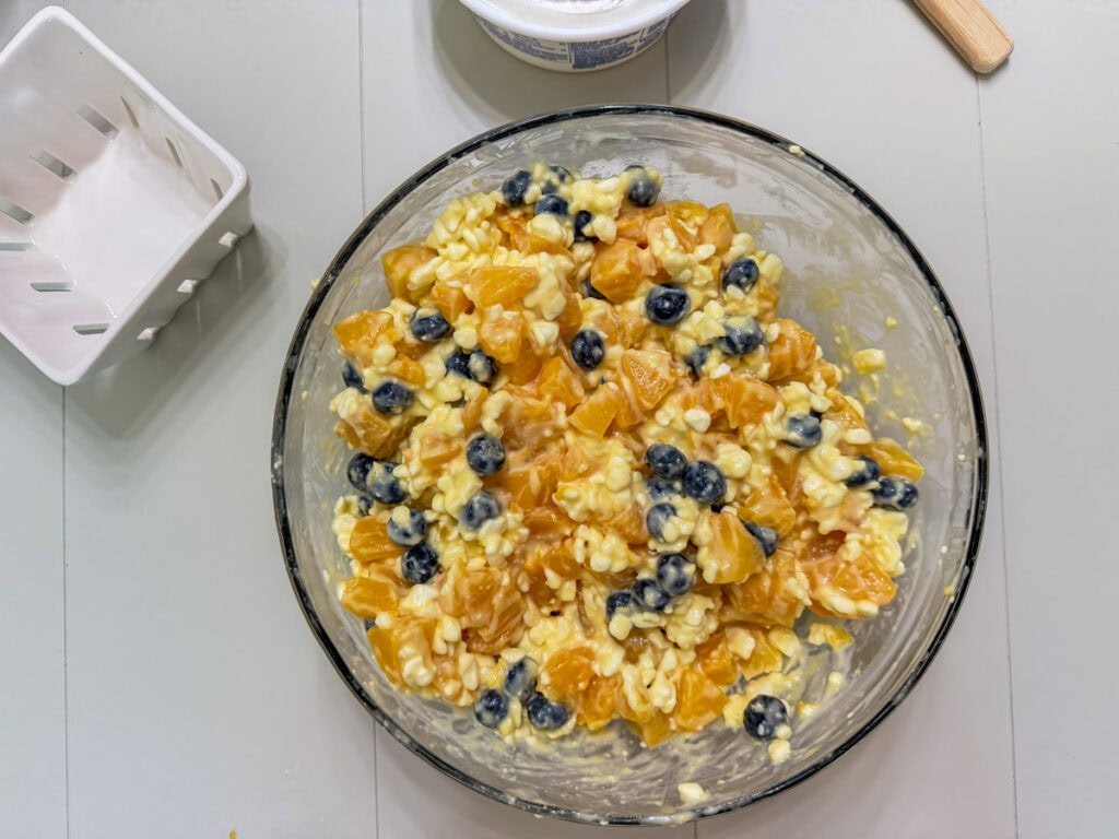 The diced peaches and fresh blueberries added to the cottage cheese mixture.
