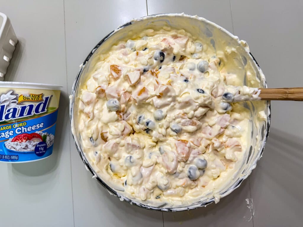 The whipped topping folded into the fruit mixture.