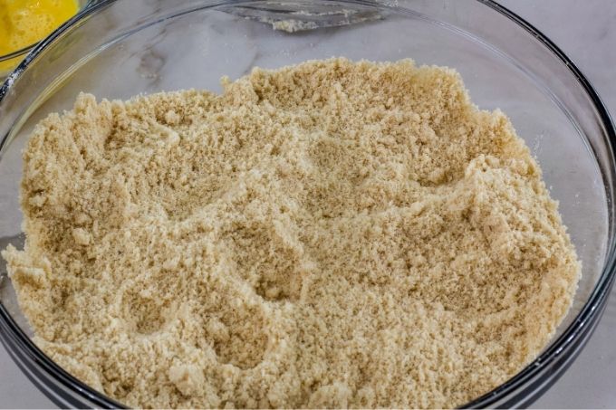 The butter mixed into the dry mixture to resemble coarse crumbs.