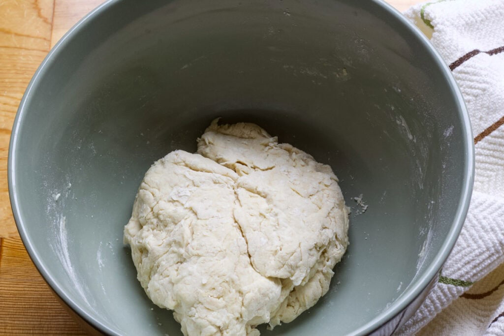 The mixed dough in a large bowl before it has risen.