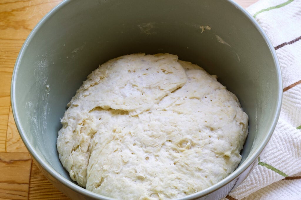 The dough in a large bowl after it has risen.