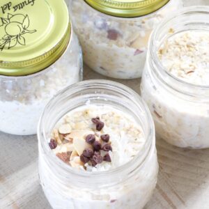Four small jars filled with almond joy overnight oats.