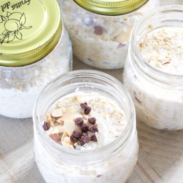Four small jars filled with almond joy overnight oats.