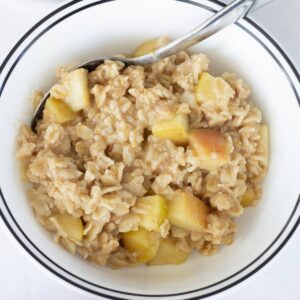 Closeup overhead of a bowl of apple cinnamon oatmeal.