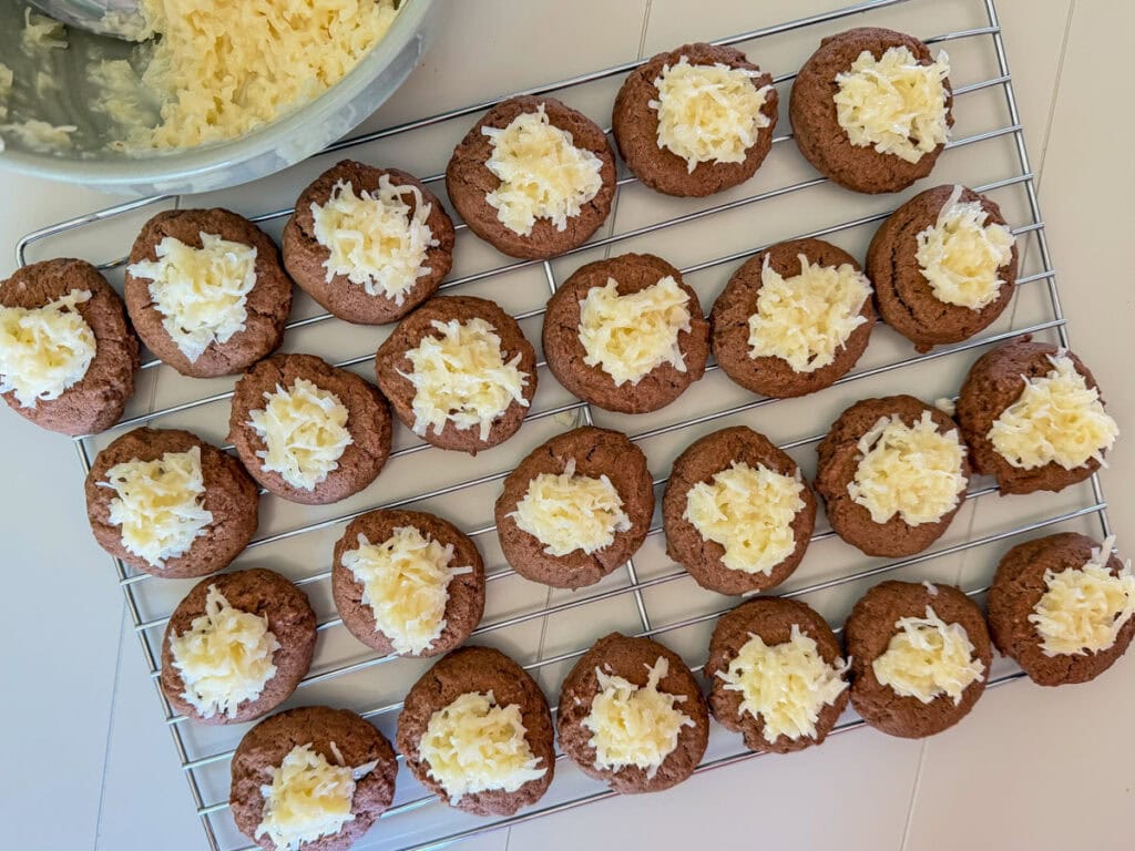The sweet coconut topping place in the indent on several cookies.