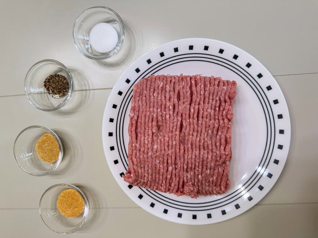 A pound of ground turkey, onion powder, garlic powder, salt and black pepper to make air fryer turkey burgers.