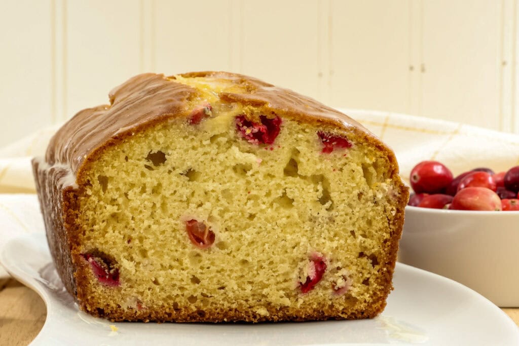 Closeup of the cut Cranberry Bread so the tender inside is visible.