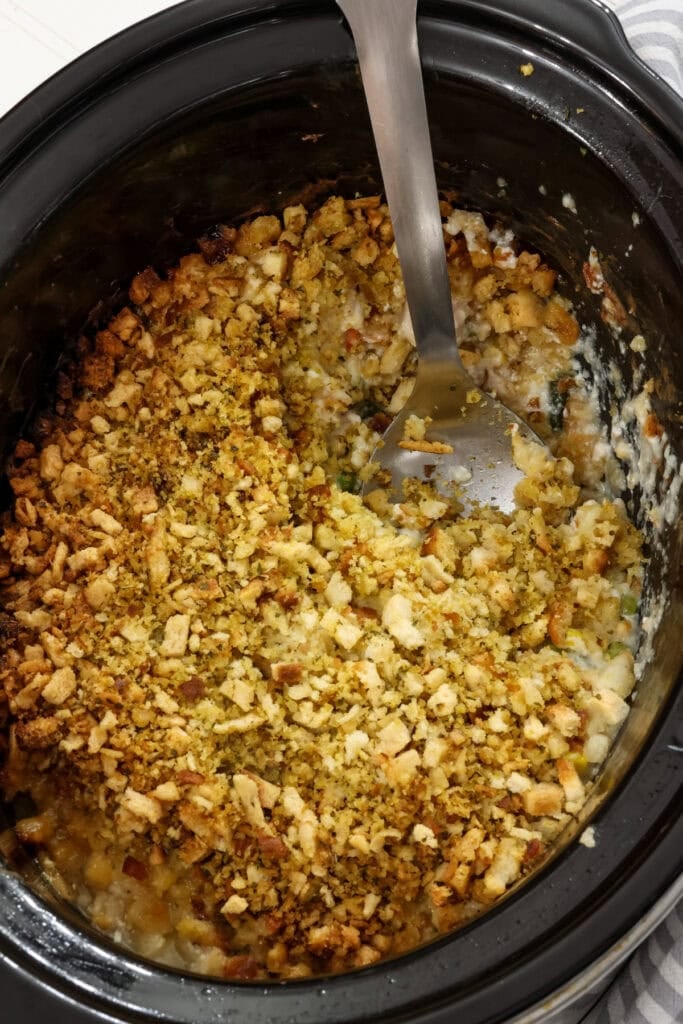 Overhead shot of chicken and stuffing casserole in a crock pot.