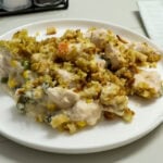 Closeup of one serving of easy chicken and stuffing casserole on a white plate.